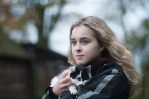 girl holding cat